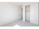 Cozy bedroom with plush carpet and a closet with sliding doors at 35234 N Barley St, San Tan Valley, AZ 85144