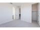 Neutrally decorated bedroom featuring a closet and an en suite bathroom at 35234 N Barley St, San Tan Valley, AZ 85144
