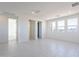 Bonus room with white walls, tile flooring, recessed lighting and ample natural light from windows at 35234 N Barley St, San Tan Valley, AZ 85144