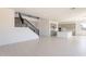 Open concept living space flows to the modern kitchen with grey cabinets at 35234 N Barley St, San Tan Valley, AZ 85144