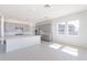 Bright kitchen with gray cabinetry, large island and stainless steel appliances at 35234 N Barley St, San Tan Valley, AZ 85144