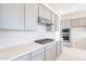 Contemporary kitchen with stainless steel gas range and subway tile backsplash at 35234 N Barley St, San Tan Valley, AZ 85144