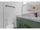 Stylish bathroom featuring a modern vanity with granite countertops and matte black hardware at 3607 N 79Th Ave, Phoenix, AZ 85033