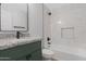 Beautiful bathroom featuring a tiled shower and a vanity with granite countertop and black hardware at 3607 N 79Th Ave, Phoenix, AZ 85033