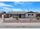 Charming single-story home with desert landscaping and stylish gray paint scheme at 3607 N 79Th Ave, Phoenix, AZ 85033