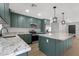 Beautiful kitchen featuring green cabinetry, granite countertops and stainless steel appliances at 3607 N 79Th Ave, Phoenix, AZ 85033