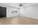 Simple living room featuring new vinyl flooring, neutral colors and fresh paint at 3607 N 79Th Ave, Phoenix, AZ 85033
