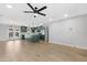 Open-concept living area showcasing updated flooring and a modern kitchen design at 3607 N 79Th Ave, Phoenix, AZ 85033