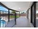 Covered patio area overlooking the backyard with pool, artificial turf, and wrought iron fence at 3607 N 79Th Ave, Phoenix, AZ 85033