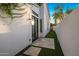 Private backyard with artificial grass, tiled patio, and minimal landscaping, perfect for relaxation at 3626 N Mohave Way, Scottsdale, AZ 85251