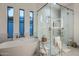 Bright bathroom with a soaking tub, glass shower, and modern fixtures at 3626 N Mohave Way, Scottsdale, AZ 85251