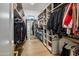 Spacious walk-in closet with custom shelving and ample storage, designed for organization and style at 3626 N Mohave Way, Scottsdale, AZ 85251