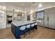 Gourmet kitchen features a large center island with seating, custom cabinetry, and stainless steel appliances at 3626 N Mohave Way, Scottsdale, AZ 85251