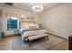 Serene main bedroom with a chandelier, large bed, and modern decor at 3626 N Mohave Way, Scottsdale, AZ 85251