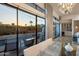 View of the yard and pool from inside the living room through sliding glass doors at 3626 N Mohave Way, Scottsdale, AZ 85251