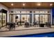 Relaxing backyard area with pool and outdoor seating, with views into well-lit living spaces at 3626 N Mohave Way, Scottsdale, AZ 85251