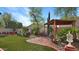 Beautiful backyard with well-manicured artificial lawn, covered patio, and above-ground pool at 4073 E Stable Ct, Gilbert, AZ 85297
