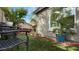 Backyard patio with comfortable seating area surrounded by a lush, landscaped yard at 4073 E Stable Ct, Gilbert, AZ 85297