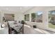 Bright dining area featuring backyard views, vaulted ceilings, and modern flooring at 4073 E Stable Ct, Gilbert, AZ 85297