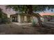 Charming single-story home featuring desert landscaping, a stone pathway, and a cozy covered porch at 4073 E Stable Ct, Gilbert, AZ 85297