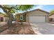 Exterior shot featuring a well-maintained two-car garage and desert landscaping at 4073 E Stable Ct, Gilbert, AZ 85297