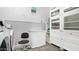 Well-lit laundry room with ample storage, modern appliances and charming butterfly décor at 4073 E Stable Ct, Gilbert, AZ 85297