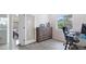 Home office with a glass top desk, and an opening to the dining room at 4073 E Stable Ct, Gilbert, AZ 85297