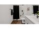 Well-lit bathroom featuring a tub, shower, and black accents at 4283 W Nora Dr, San Tan Valley, AZ 85144