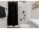 Bright bathroom featuring a black shower curtain and white subway tiles at 4283 W Nora Dr, San Tan Valley, AZ 85144