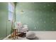Bright bedroom featuring natural light, a cozy chair, and desert themed wall art at 4283 W Nora Dr, San Tan Valley, AZ 85144