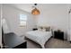 Cozy bedroom with carpet, overhead light fixture, large window and contemporary furnishings at 4283 W Nora Dr, San Tan Valley, AZ 85144
