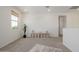 Bright bonus room area with window, built-in storage, and neutral decor at 4283 W Nora Dr, San Tan Valley, AZ 85144