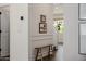 Bright hallway with a wooden bench, decorative wall trim, and wood-look floors at 4283 W Nora Dr, San Tan Valley, AZ 85144