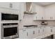 Close-up of stainless steel oven and gas range with white cabinetry at 4283 W Nora Dr, San Tan Valley, AZ 85144