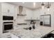 Stylish kitchen showcasing stainless steel appliances and white cabinetry at 4283 W Nora Dr, San Tan Valley, AZ 85144
