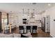 Modern kitchen features a large island, stainless steel appliances, and dining area at 4283 W Nora Dr, San Tan Valley, AZ 85144