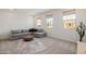 Spacious living area with gray sectional couch and ample natural light at 4283 W Nora Dr, San Tan Valley, AZ 85144