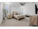 Bright main bedroom with neutral tones, carpeted floors, and ample natural light at 4283 W Nora Dr, San Tan Valley, AZ 85144