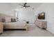 Spacious main bedroom with large windows, modern furniture, and comfortable carpet at 4283 W Nora Dr, San Tan Valley, AZ 85144