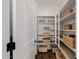 Walk-in pantry with built-in shelving and wooden baskets at 4283 W Nora Dr, San Tan Valley, AZ 85144