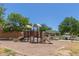 Neighborhood playground featuring slides, climbing structures, and a shaded picnic area for Gathering enjoyment at 4283 W Nora Dr, San Tan Valley, AZ 85144