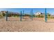A playground features a unique web climber structure with blue posts and tan sand at 4283 W Nora Dr, San Tan Valley, AZ 85144