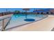 This community pool features a mushroom water feature and nearby lounge area at 4283 W Nora Dr, San Tan Valley, AZ 85144