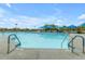 This community pool offers swimming lanes and a lounging area with protective sun shades at 4283 W Nora Dr, San Tan Valley, AZ 85144