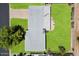 An aerial view of the property showcases a well-maintained roof, lush lawn, and patio area at 4510 E Calle Tuberia --, Phoenix, AZ 85018