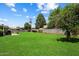 Spacious backyard with lush green lawn and mature trees, great for outdoor activities at 4510 E Calle Tuberia --, Phoenix, AZ 85018