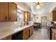 A quaint eat-in kitchen with wood cabinets, white tile counters, and a window to let the light in at 4510 E Calle Tuberia --, Phoenix, AZ 85018