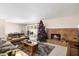 A cozy living room with a brick fireplace and Christmas tree creates a warm, inviting space at 4510 E Calle Tuberia --, Phoenix, AZ 85018