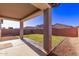 This house offers a covered patio and grassy backyard at 45722 W Sky Ln, Maricopa, AZ 85139