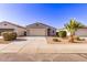 Inviting one-story home with desert landscaping, large driveway, and covered entry, offering curb appeal at 45722 W Sky Ln, Maricopa, AZ 85139